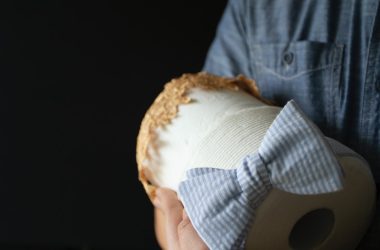 person holding white and brown bread