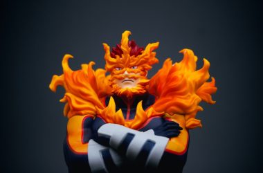 a close up of a figurine of a person with fire on his face