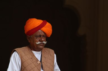 a man wearing a turban and a moustache