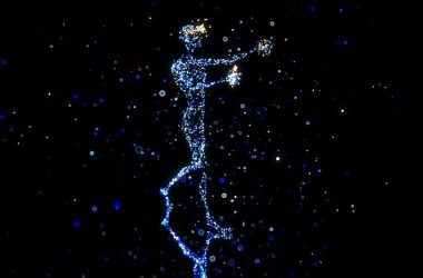 a person standing in the air with a star in their hand