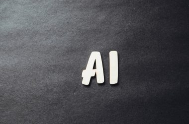 the word ai spelled in white letters on a black surface