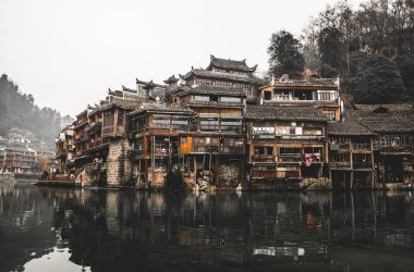 brown wooden houses beside river