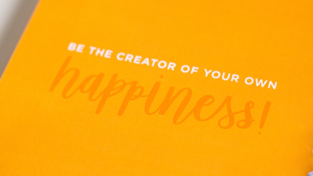 a yellow greeting card with the words be the creator of your own happiness
