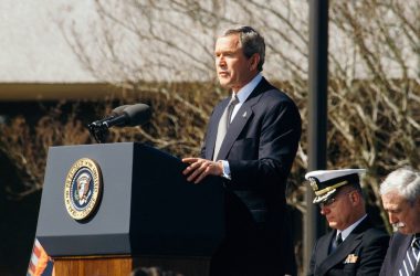 George W. Bush standing on lectern during daytime