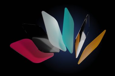 a group of different colored surfboards on a black background