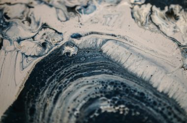 a close up of a black and white abstract painting