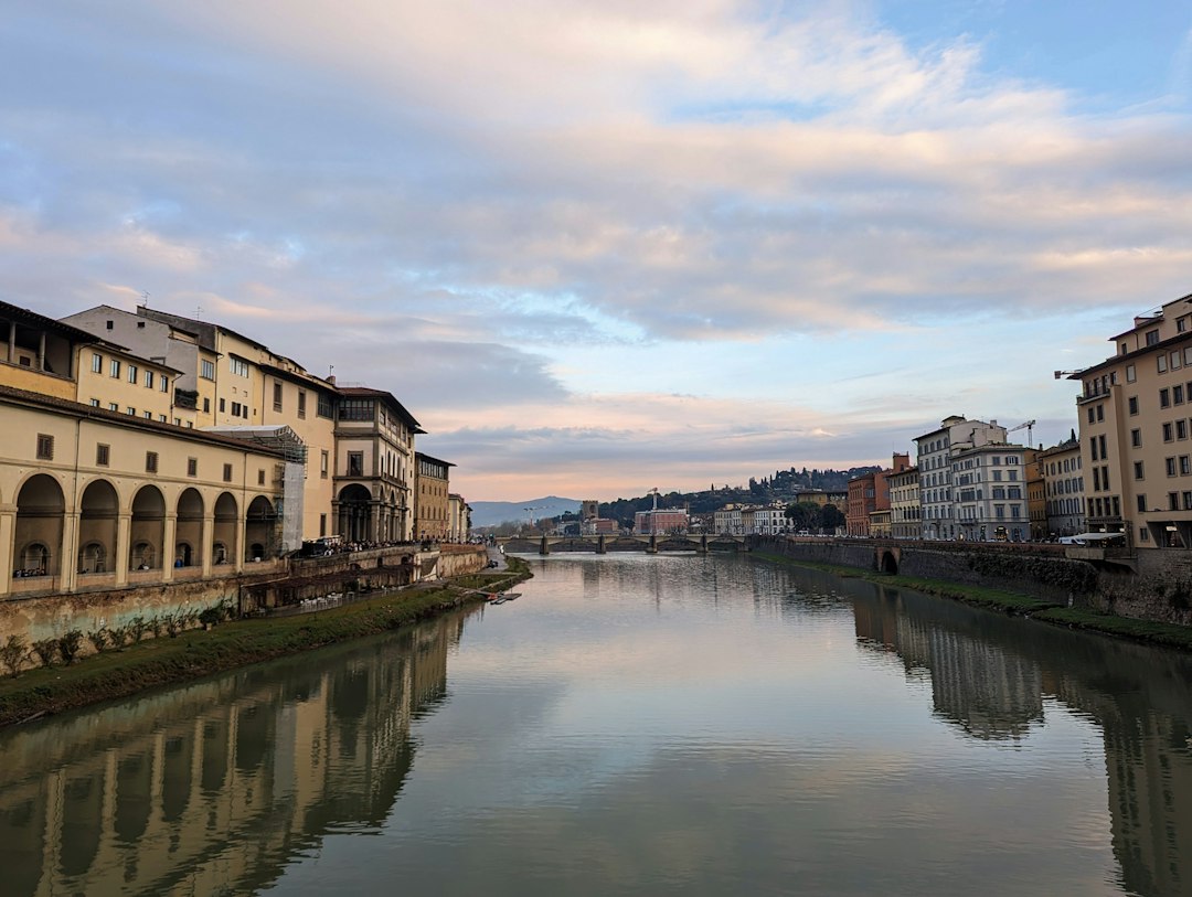 a river running through a city next to tall buildings