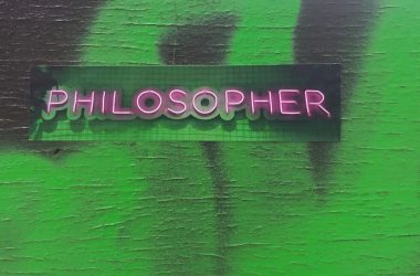 a green wall with a sign that says philosoher
