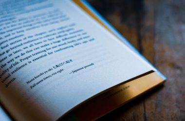 white book page on brown wooden table