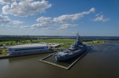 gray ship beside building