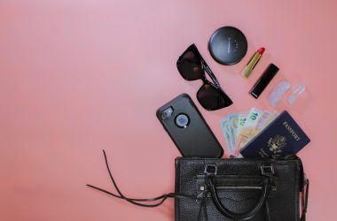 black sunglasses on black leather pouch