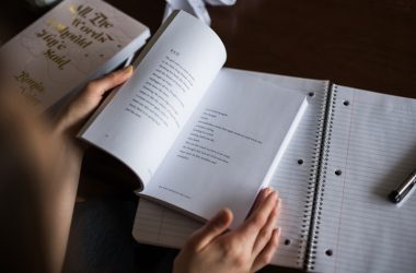 person flipping book