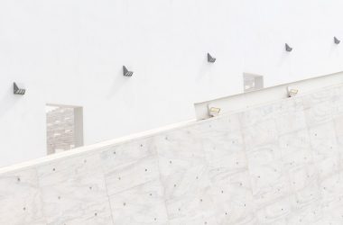 a man riding a skateboard down the side of a wall