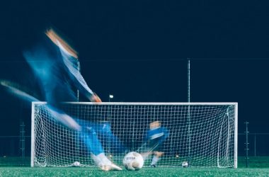 timelapse photo of soccer player kicking ball