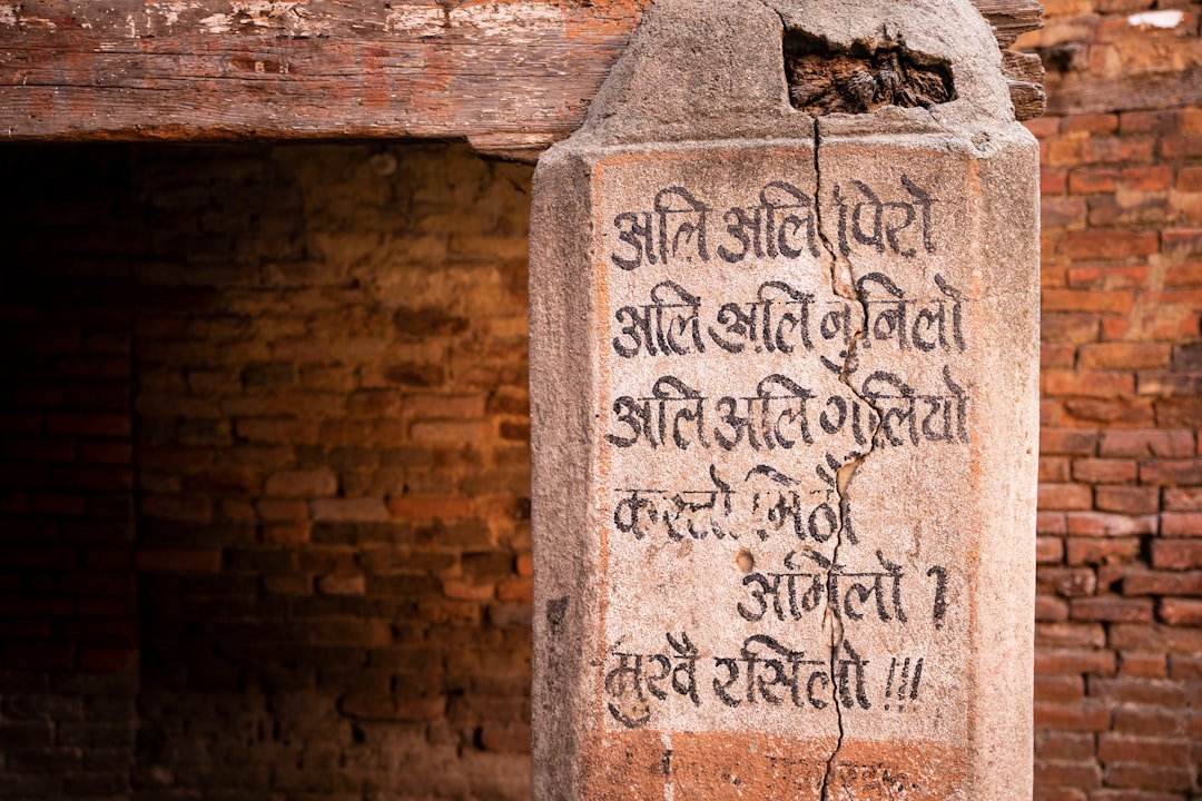 gray concrete wall with Devanagari text