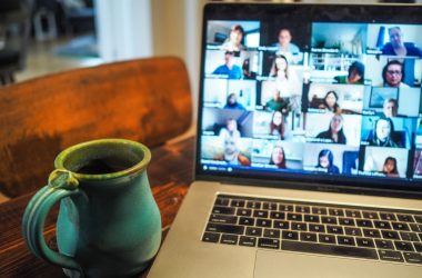 macbook pro displaying group of people