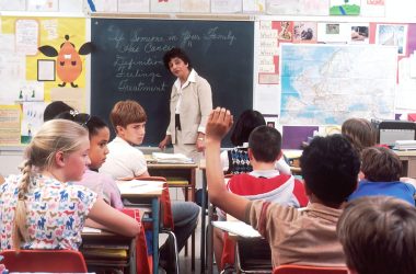 woman standing in front of children