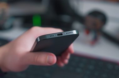 a close up of a person holding a cell phone