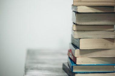 assorted books on wooden table