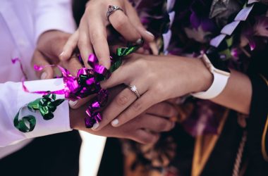 man and woman touching hands