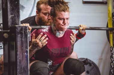 woman carrying barbells