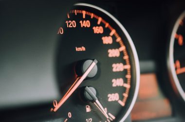 closeup photo of black analog speedometer