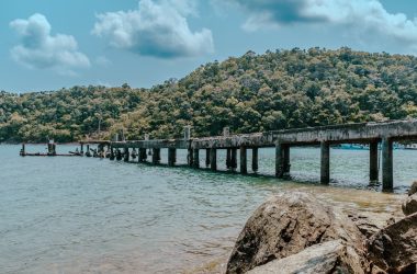 a long wooden bridge over a body of water