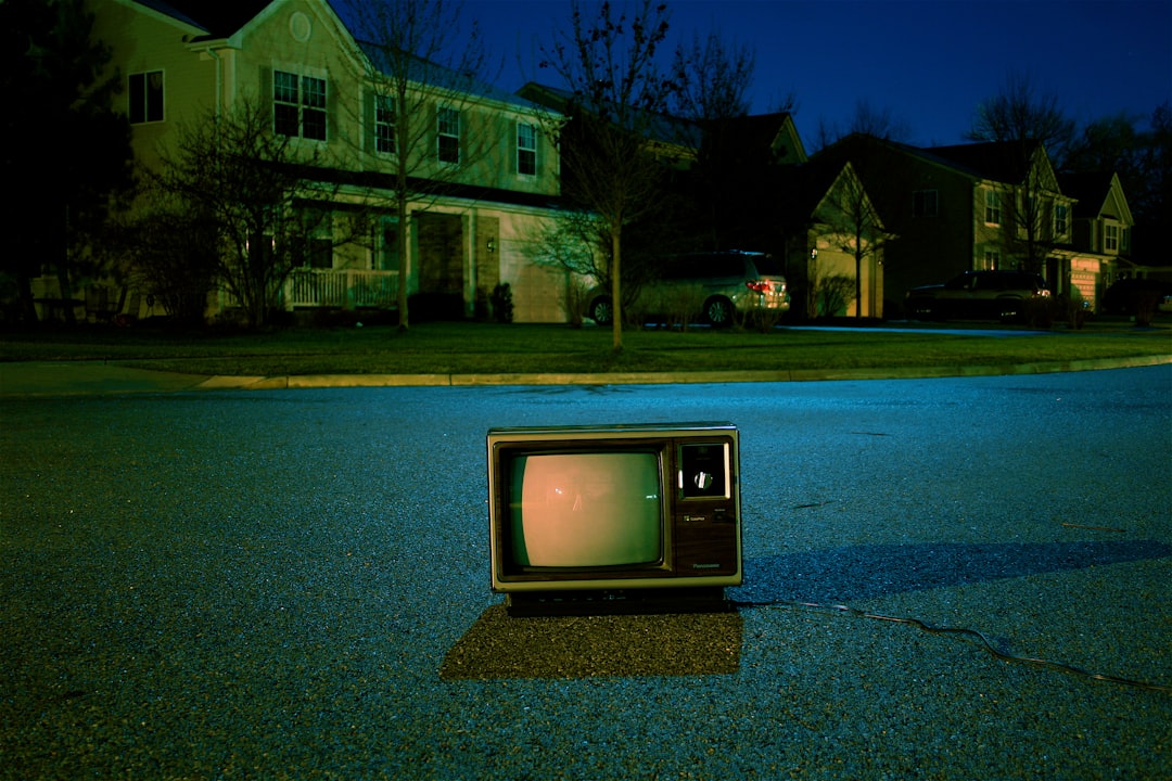 turned off vintage CRT television on road