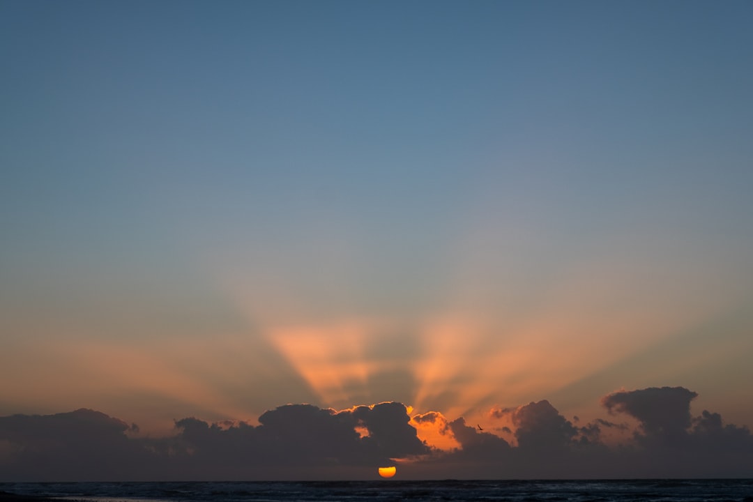 The sun is setting over a body of water