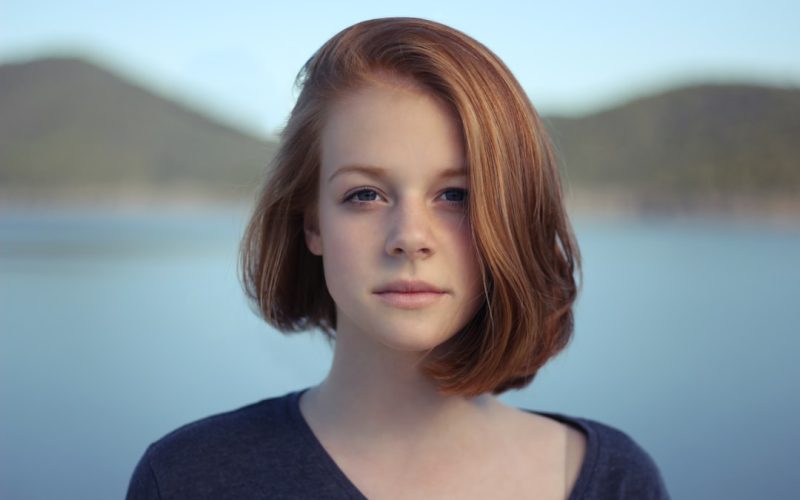 shallow focus photography of woman outdoor during day