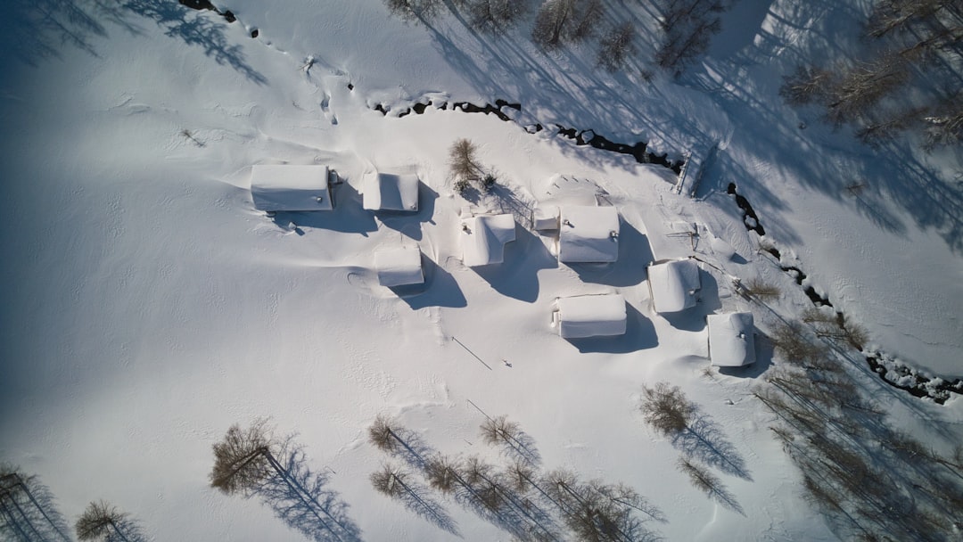 an aerial view of a snow covered field