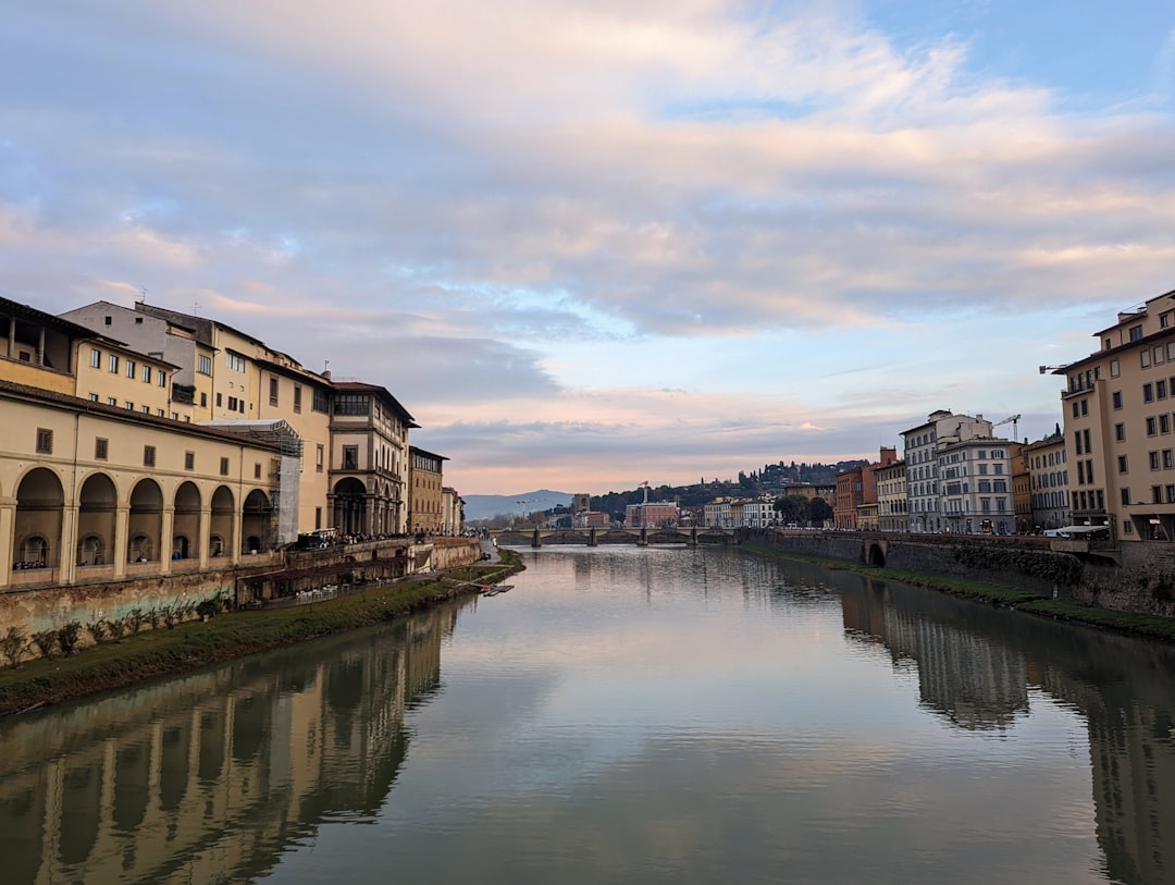 a river running through a city next to tall buildings