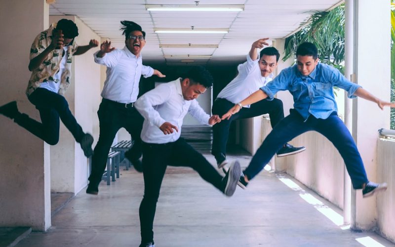 group of people doing jump shot photography
