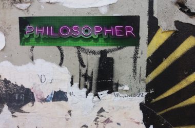 a close up of a street sign on a wall