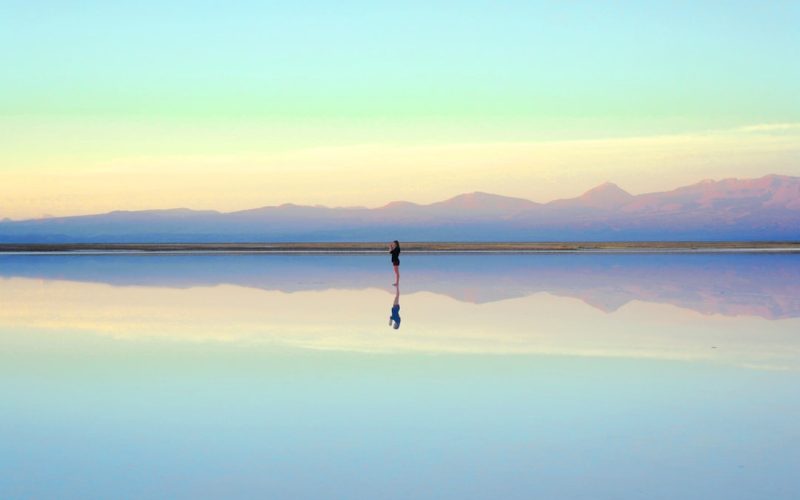 person standing near body of water during daytime