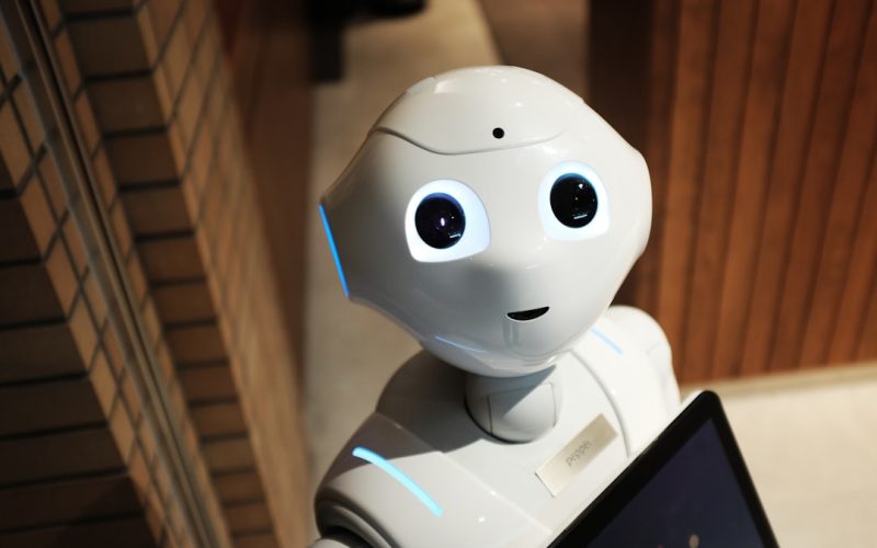 white robot near brown wall
