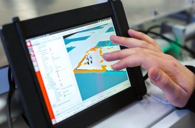 person holding black tablet computer