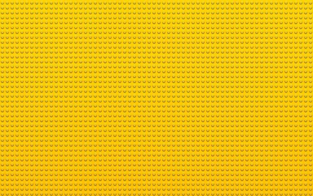 a yellow background with small dots