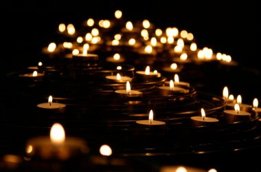 low-angle photo of lightened candles