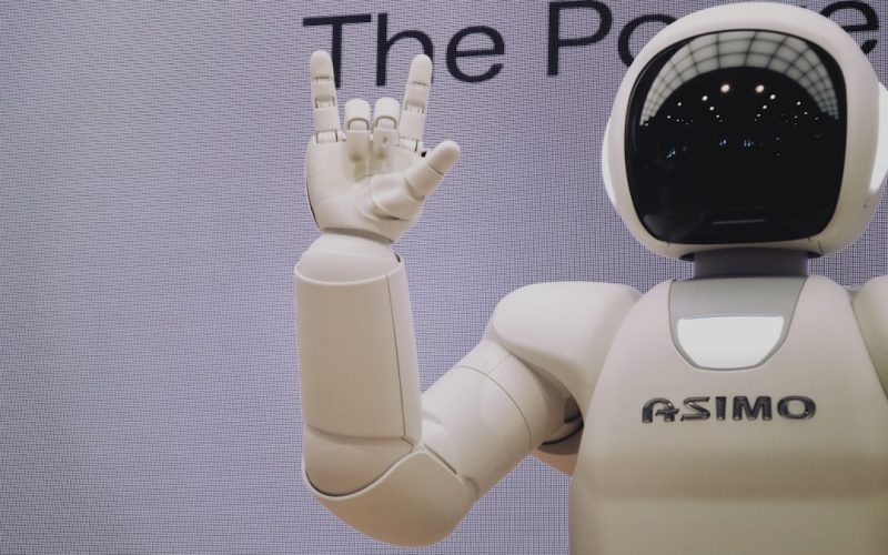 Asimo robot doing handsign