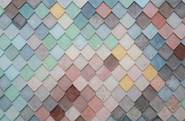 a multicolored tile wall with a pattern of small squares