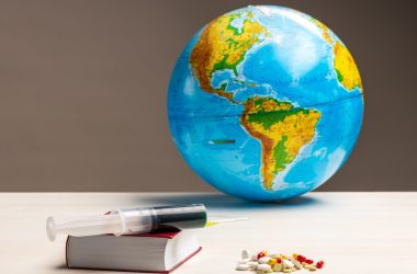 blue and green globe on white table