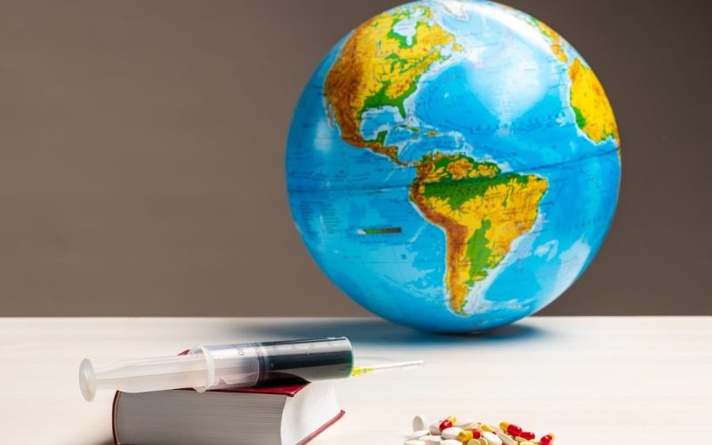 blue and green globe on white table