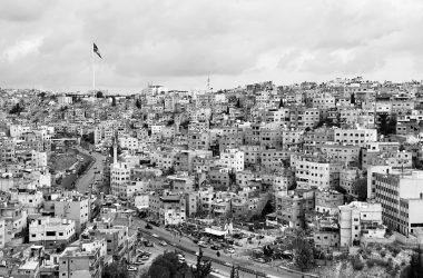 grayscale photo of city buildings during daytime
