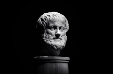 A black and white photo of a bust of a man