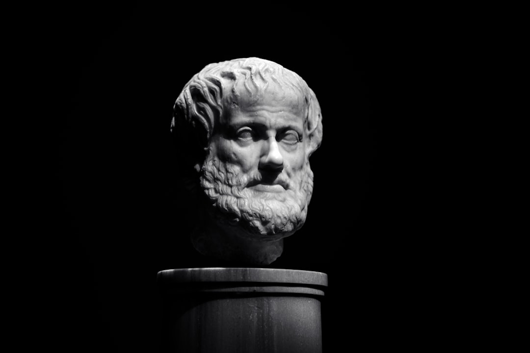 A black and white photo of a bust of a man