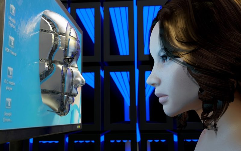 a female mannequin is looking at a computer screen
