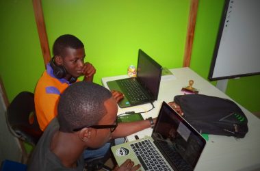 two men using laptop computes