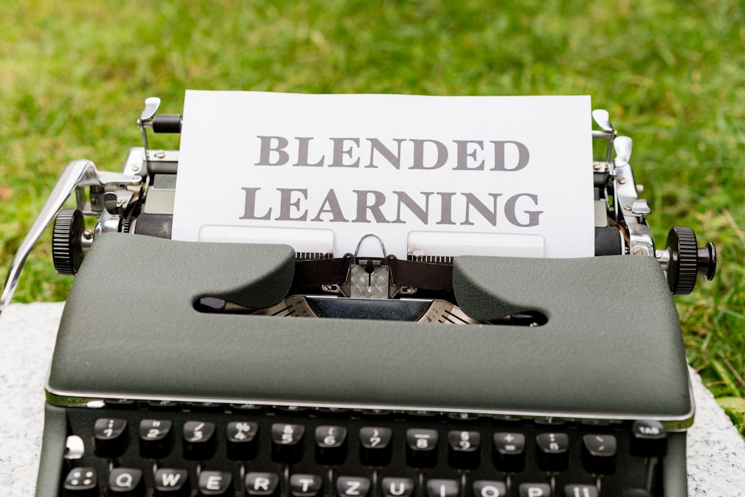 a typewriter with a sign that reads blended learning