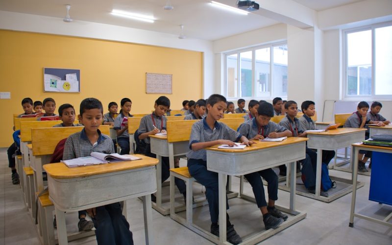 A group of children sitting at desks in a classroom